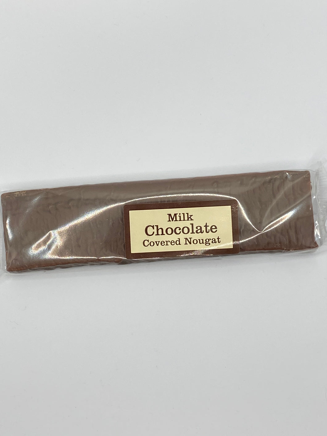 Bar of milk chocolate covered nougat